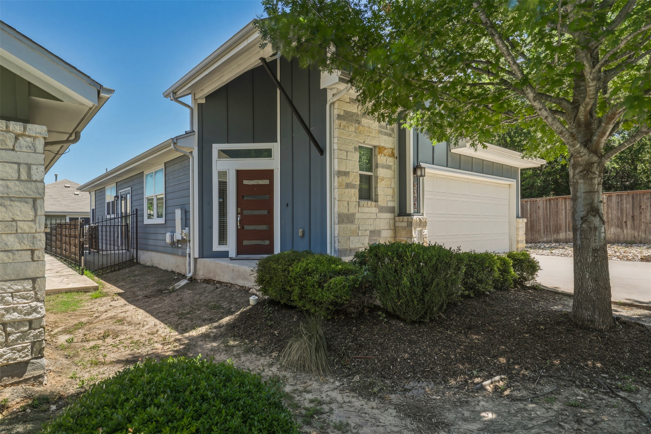 7208 Lysander Court Austin, TX 78741 - Photo 2 of 15 a front view of a house with garden