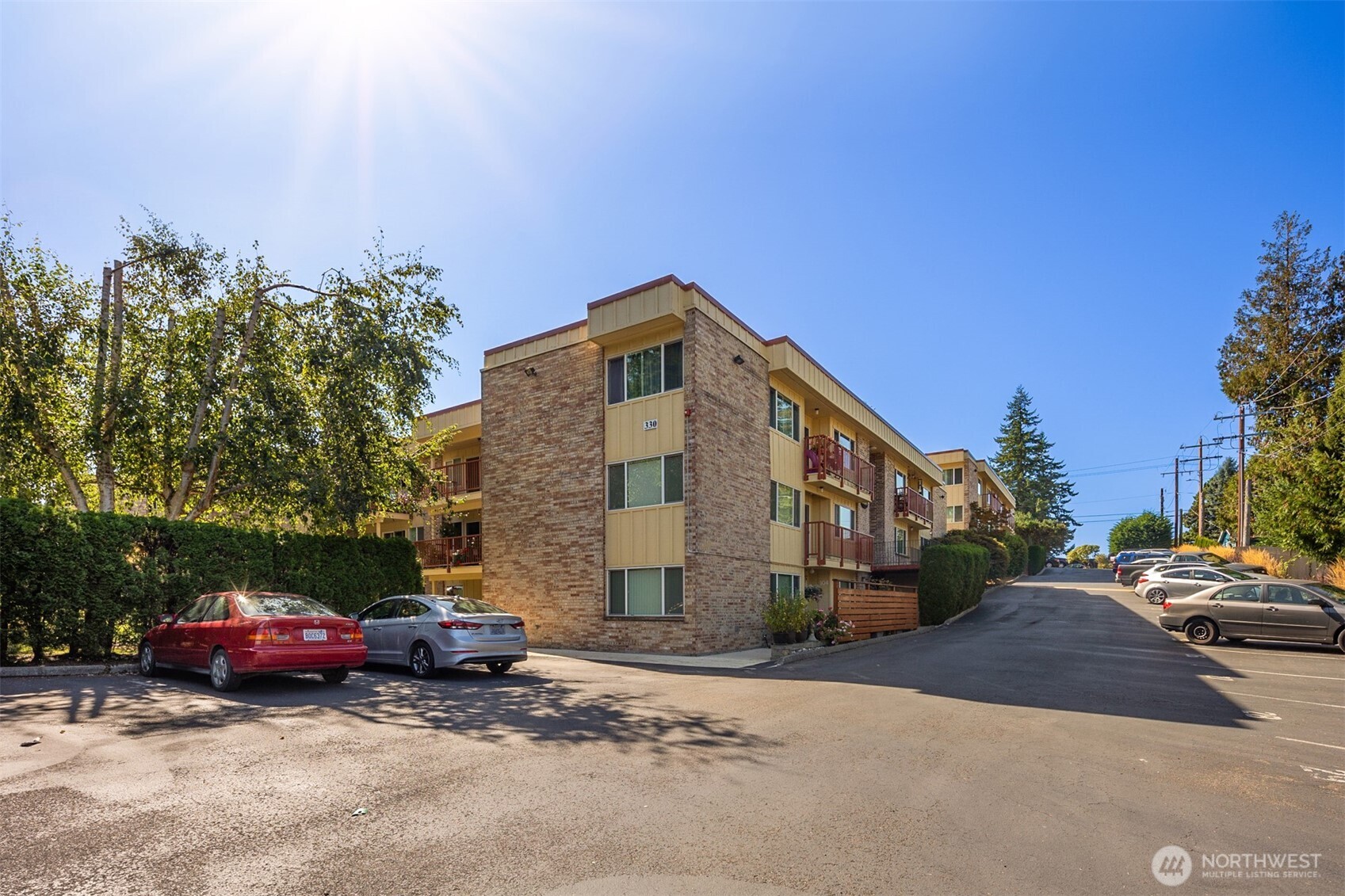 330 Elm Street, Unit 305 Everett, WA 98203 - Photo 19 of 25 a car parked in front of a house