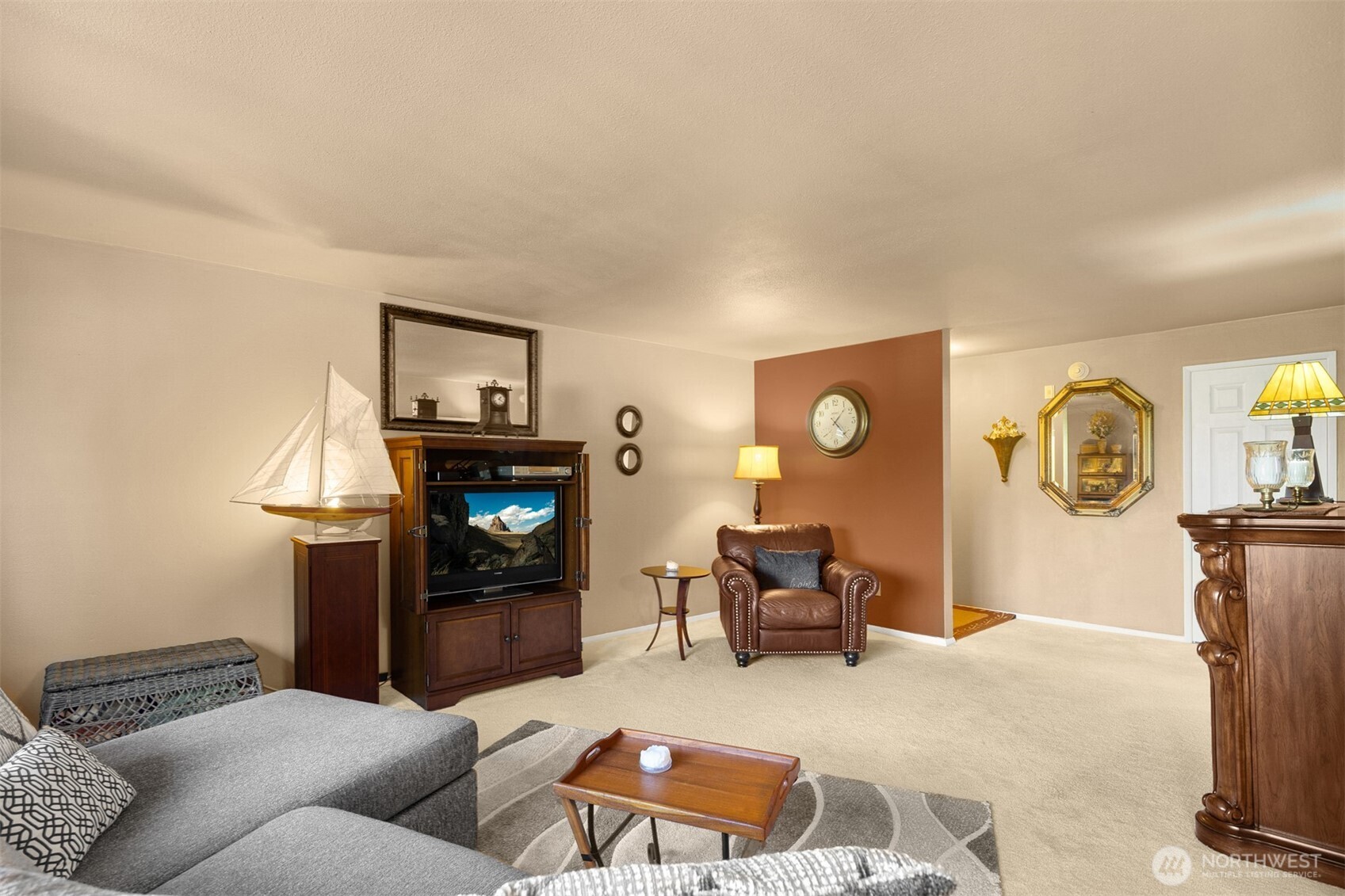 330 Elm Street, Unit 305 Everett, WA 98203 - Photo 3 of 25 a living room with furniture and a flat screen tv