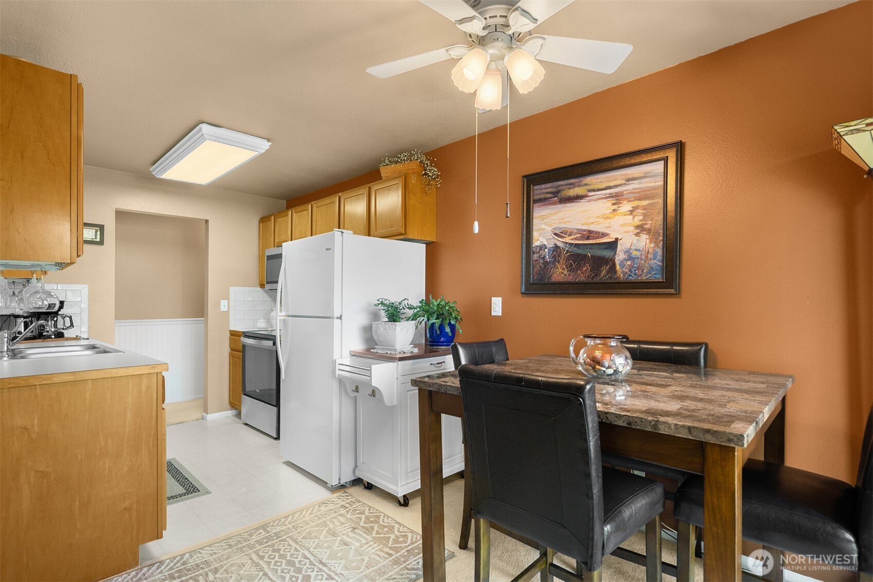 330 Elm Street, Unit 305 Everett, WA 98203 - Photo 5 of 25 a dining room with furniture and a chandelier