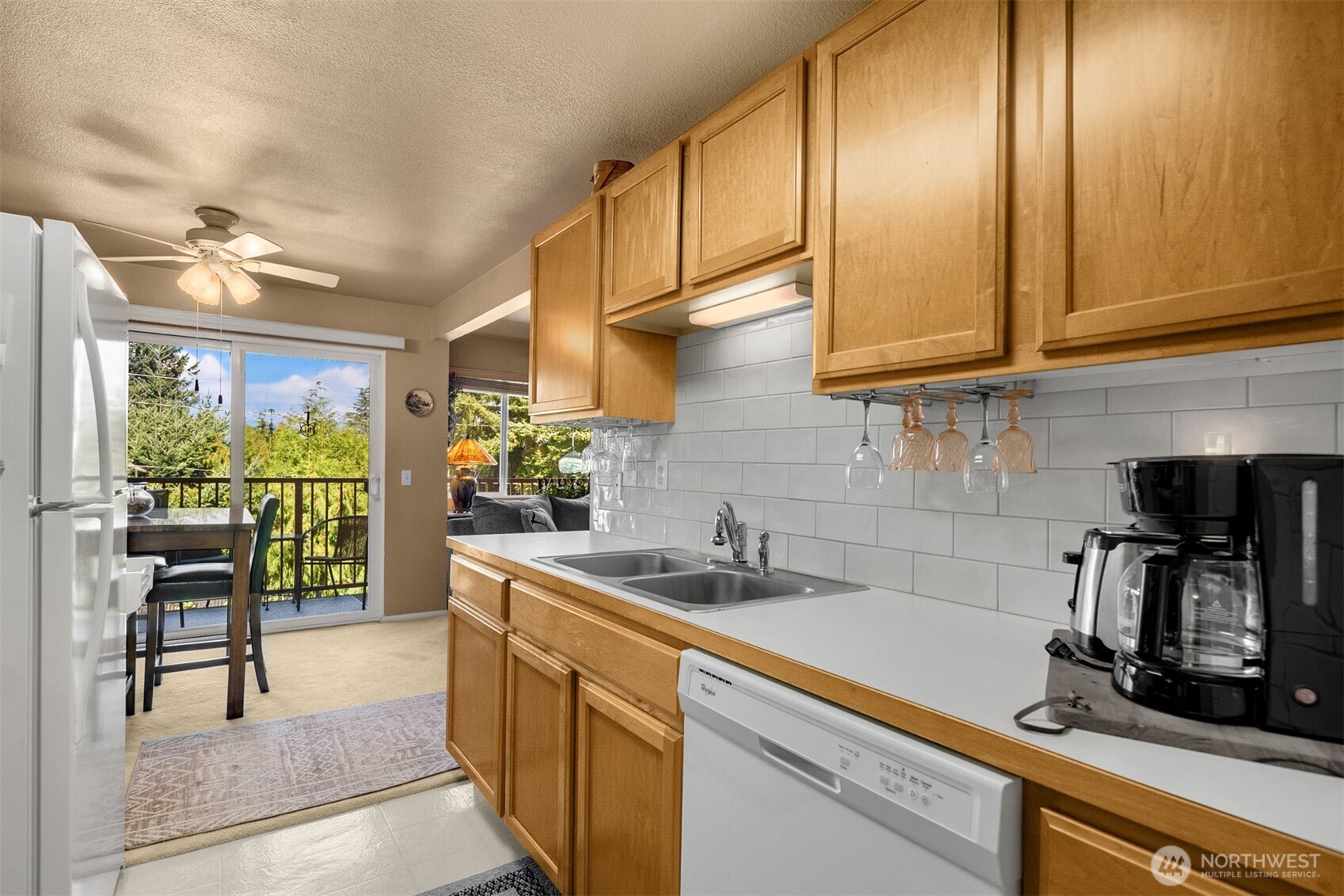 330 Elm Street, Unit 305 Everett, WA 98203 - Photo 8 of 25 a kitchen with a sink cabinets and a window
