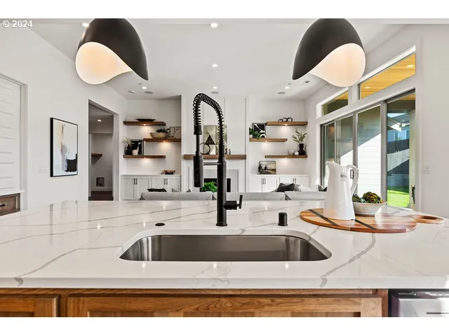 a kitchen with a sink a counter and cabinets