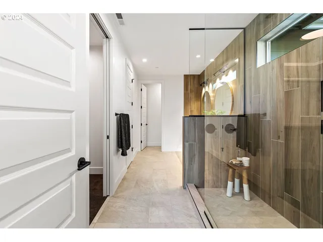 a bathroom with a glass door shower