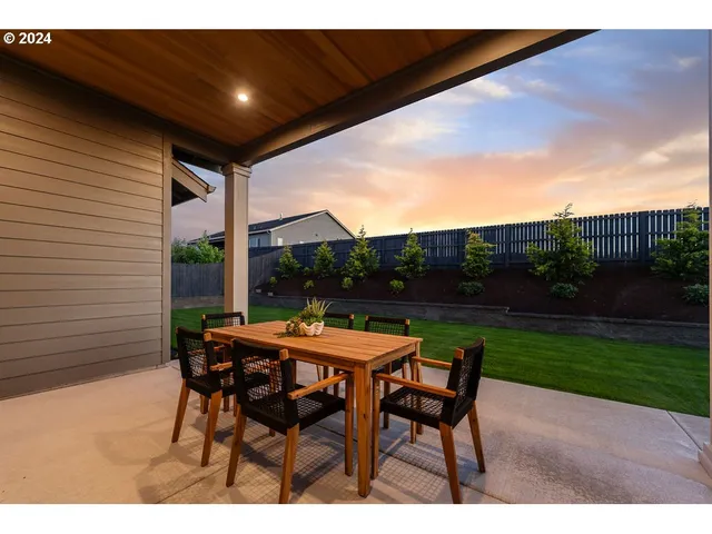 a patio with table and chairs