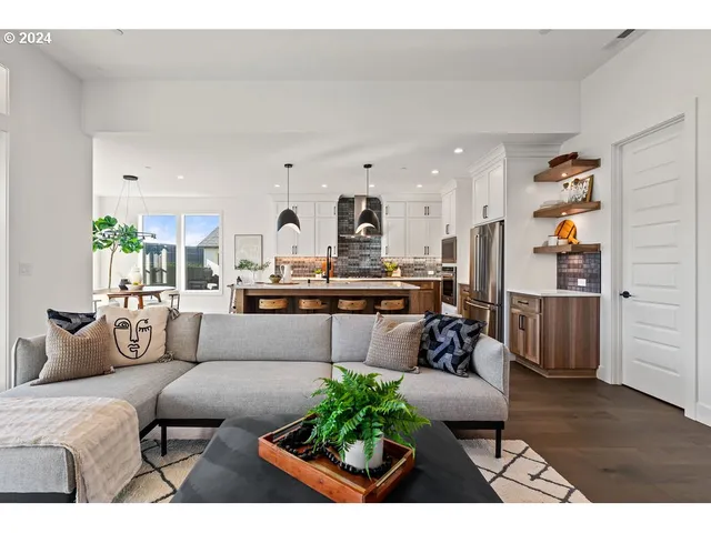a living room with furniture and a table