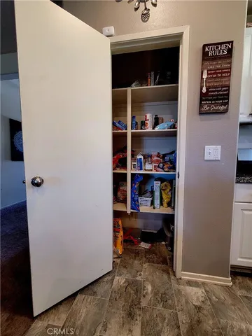 a view of workspace with wooden floor and closet