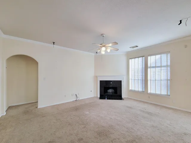 a view of empty room with a fireplace