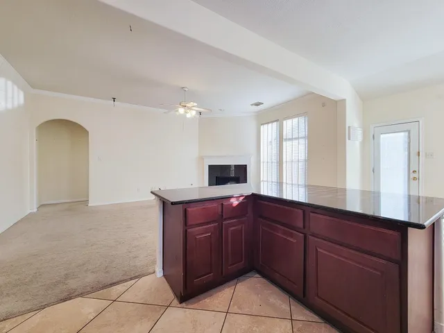 a kitchen with stainless steel appliances granite countertop a stove and a sink