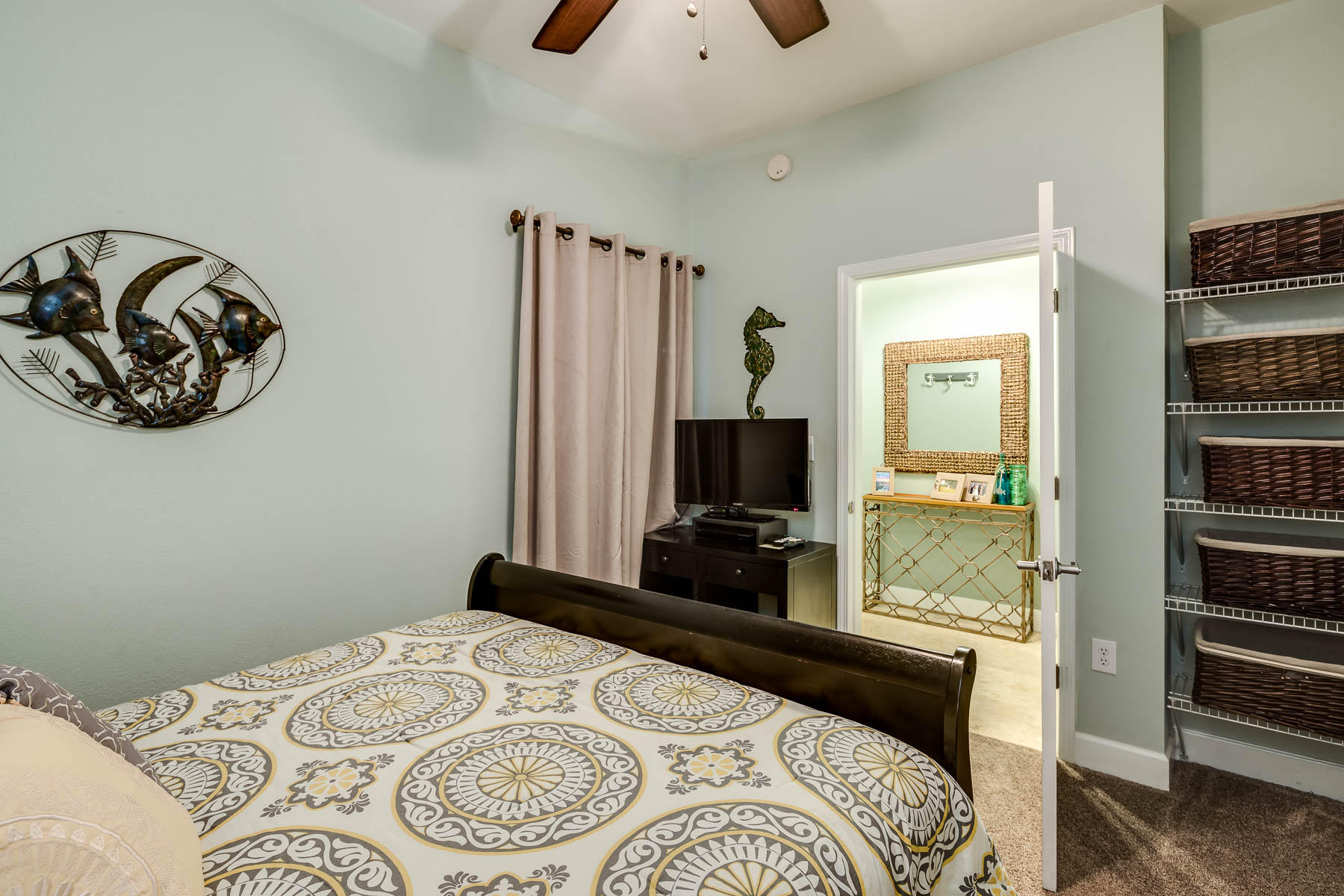 16819 Front Beach Road, Unit 3011 Panama City Beach, FL 32413 - Photo 11 of 28 a bedroom with a bed and a flat screen tv