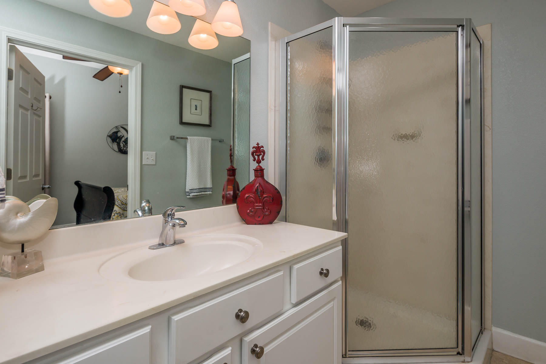 16819 Front Beach Road, Unit 3011 Panama City Beach, FL 32413 - Photo 12 of 28 a bathroom with a sink and a mirror