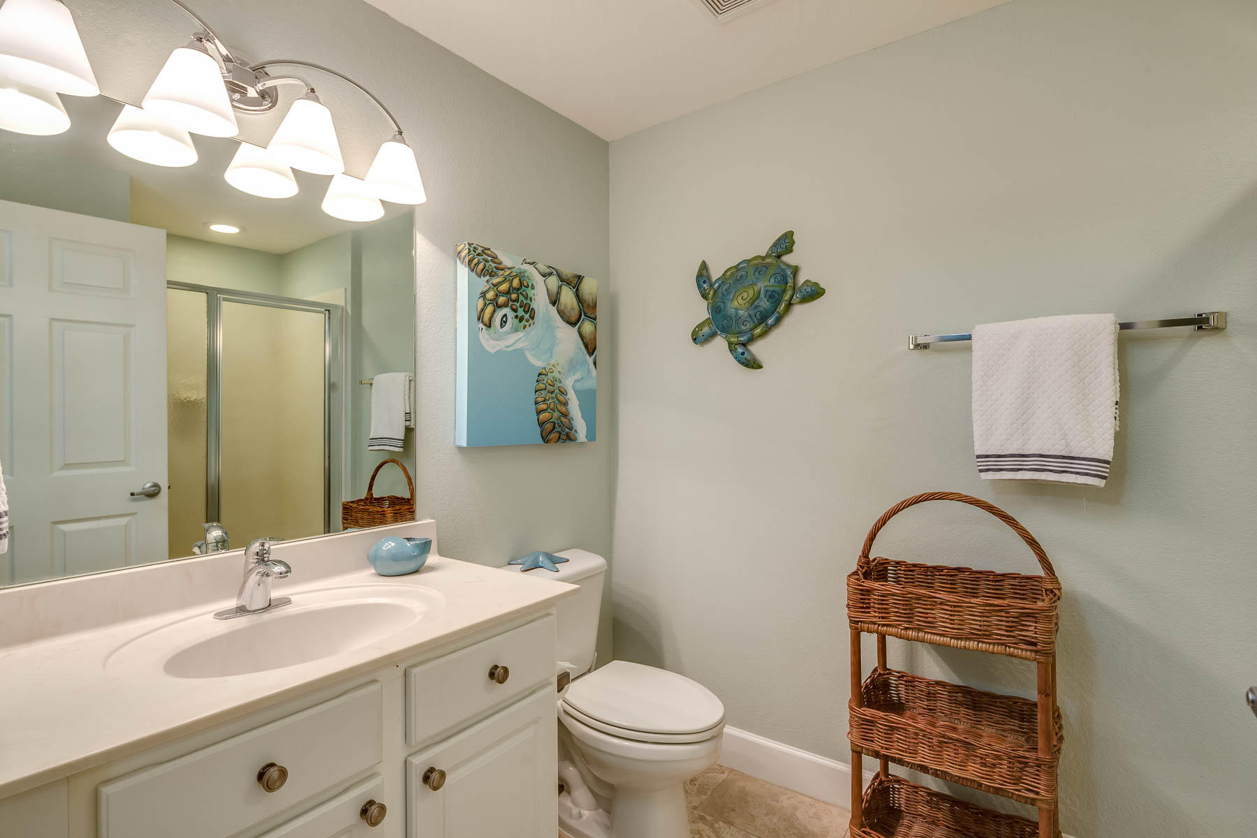 16819 Front Beach Road, Unit 3011 Panama City Beach, FL 32413 - Photo 14 of 28 a bathroom with a toilet sink and mirror