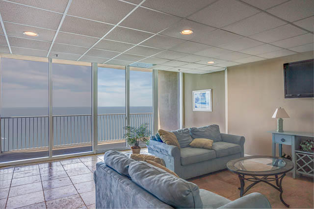 16819 Front Beach Road, Unit 3011 Panama City Beach, FL 32413 - Photo 22 of 28 a living room with furniture and a table