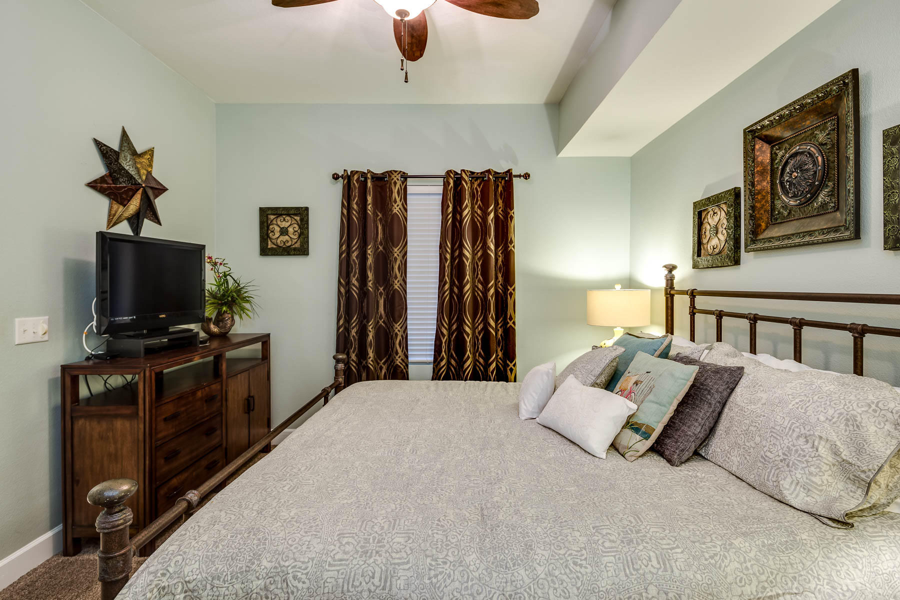 16819 Front Beach Road, Unit 3011 Panama City Beach, FL 32413 - Photo 8 of 28 a bed room with furniture and a flat screen tv