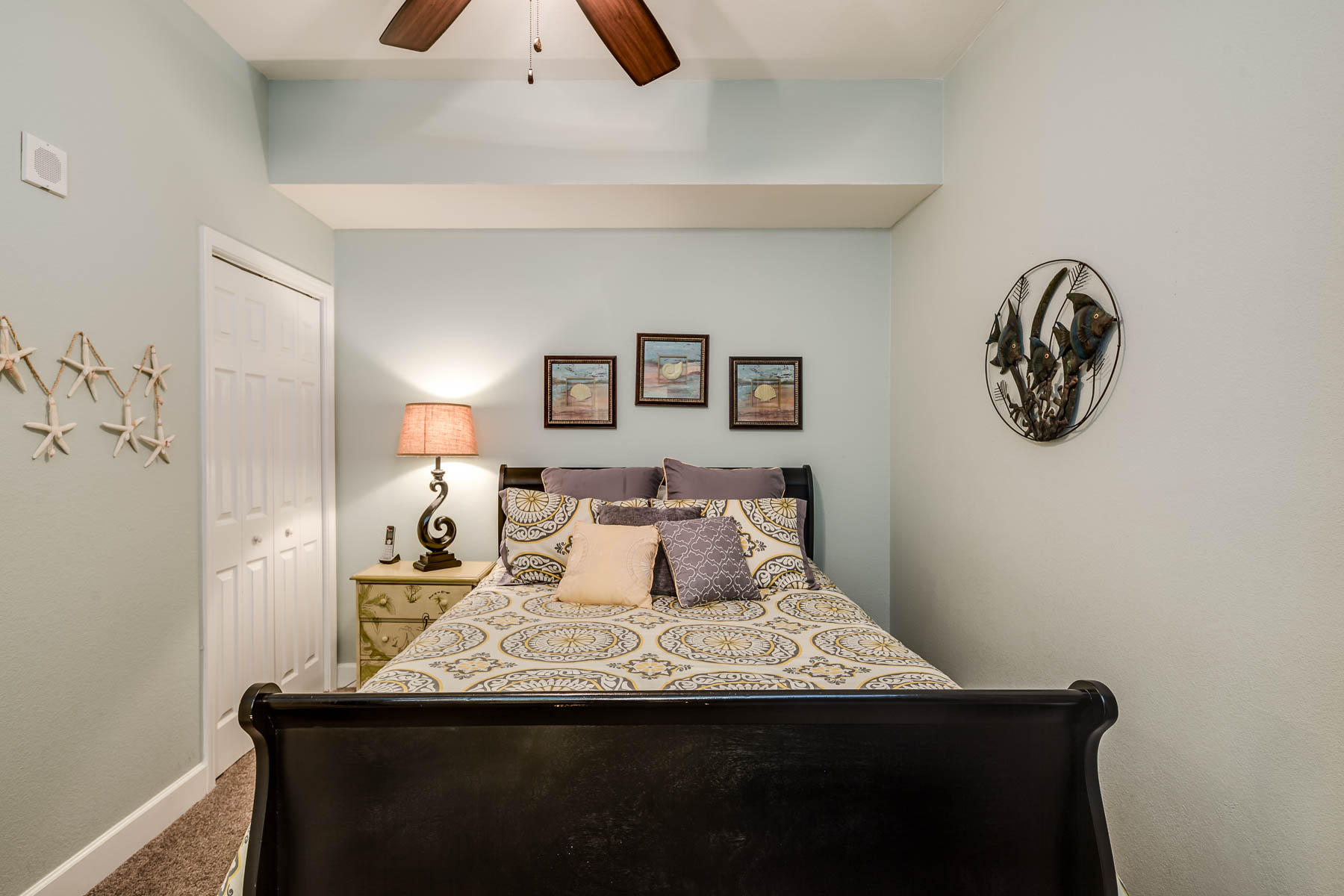16819 Front Beach Road, Unit 3011 Panama City Beach, FL 32413 - Photo 9 of 28 a bedroom with a bed and a chandelier