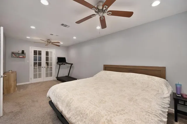 a bed room with a bed and a large mirror