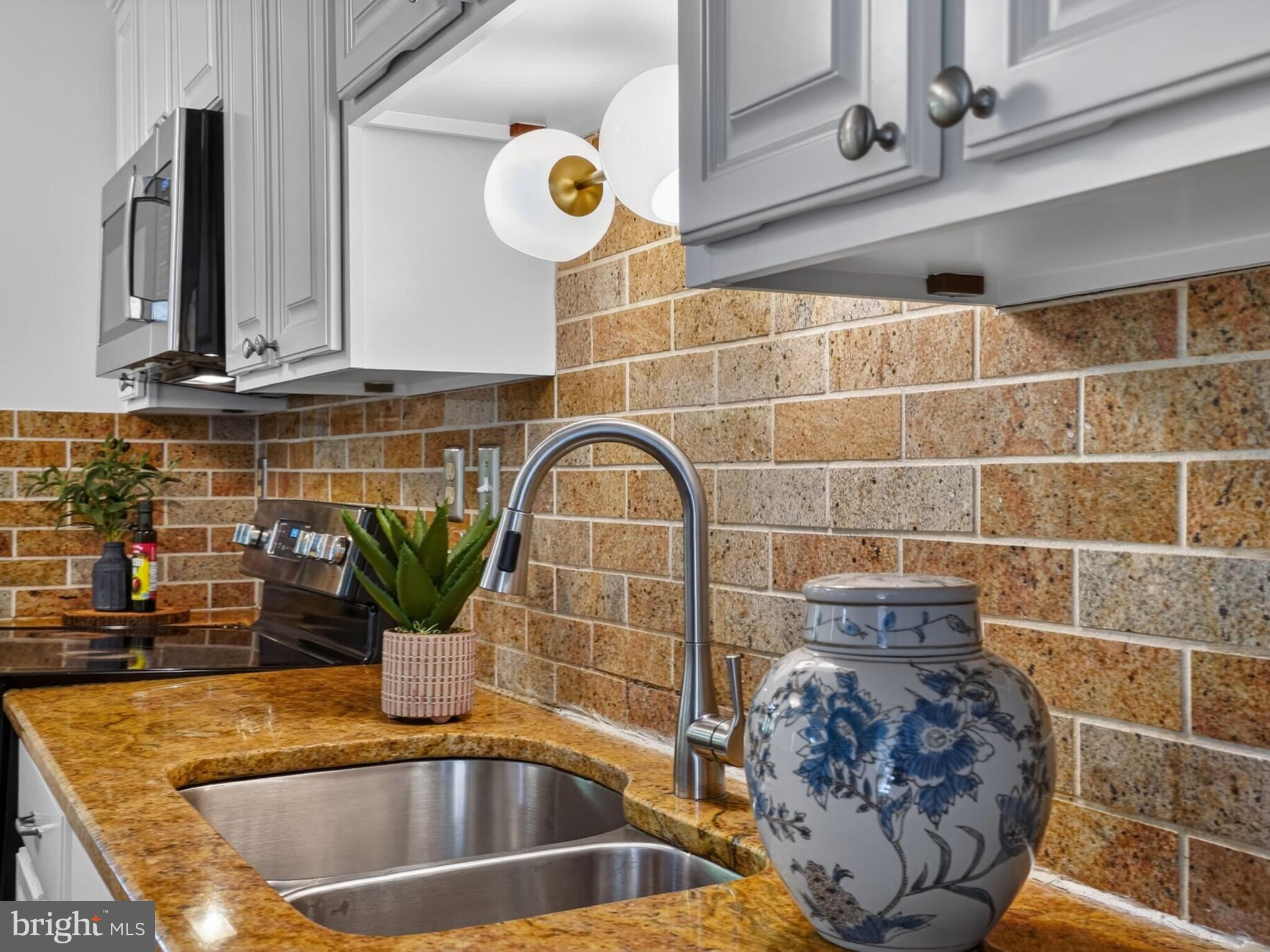 5914 Freds Oak Road Burke, VA 22015 - Photo 11 of 30 a bathroom with a sink and a mirror