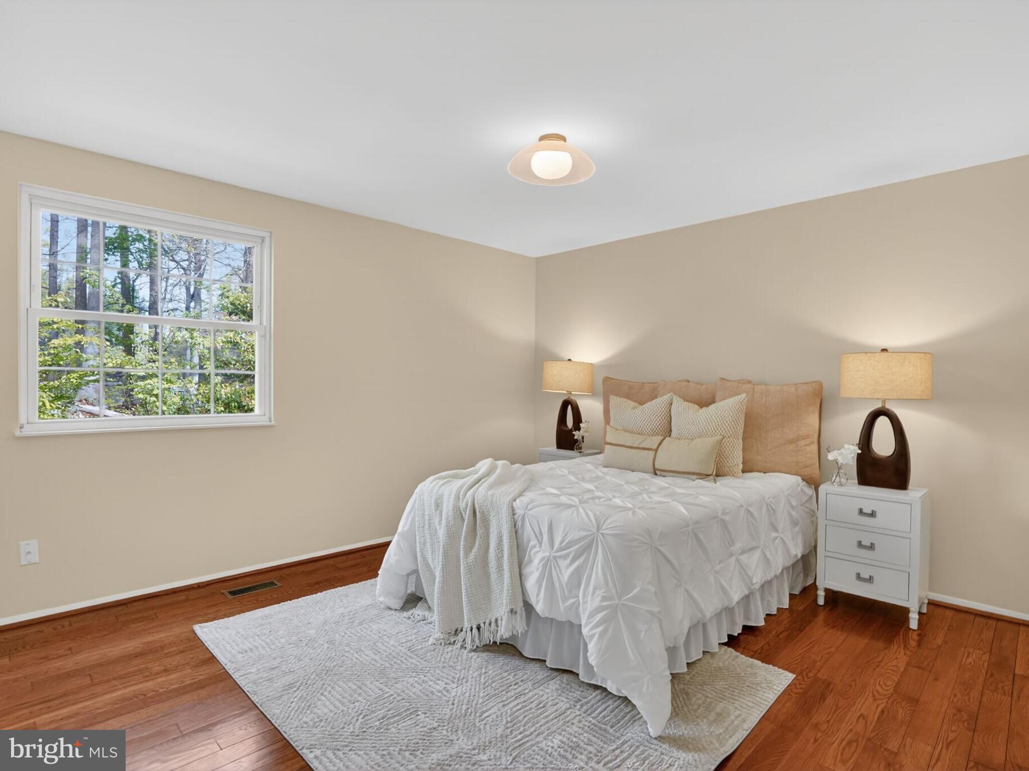 5914 Freds Oak Road Burke, VA 22015 - Photo 15 of 30 a bedroom with a bed and a window