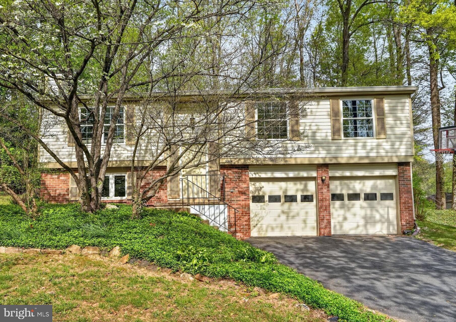 5914 Freds Oak Road Burke, VA 22015 - Photo 2 of 30 front view of a house with a street