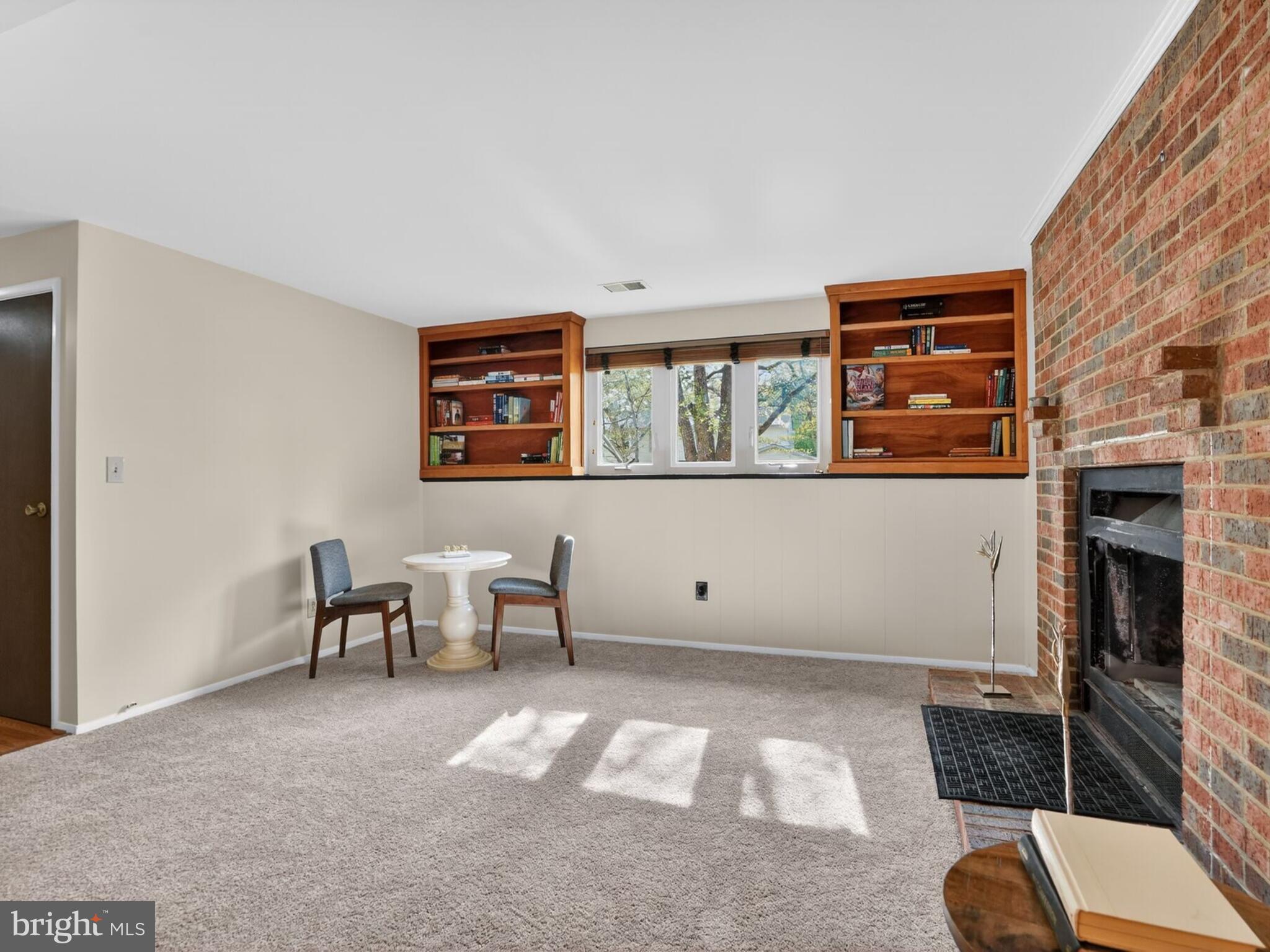 5914 Freds Oak Road Burke, VA 22015 - Photo 24 of 30 a living room with furniture and a fireplace