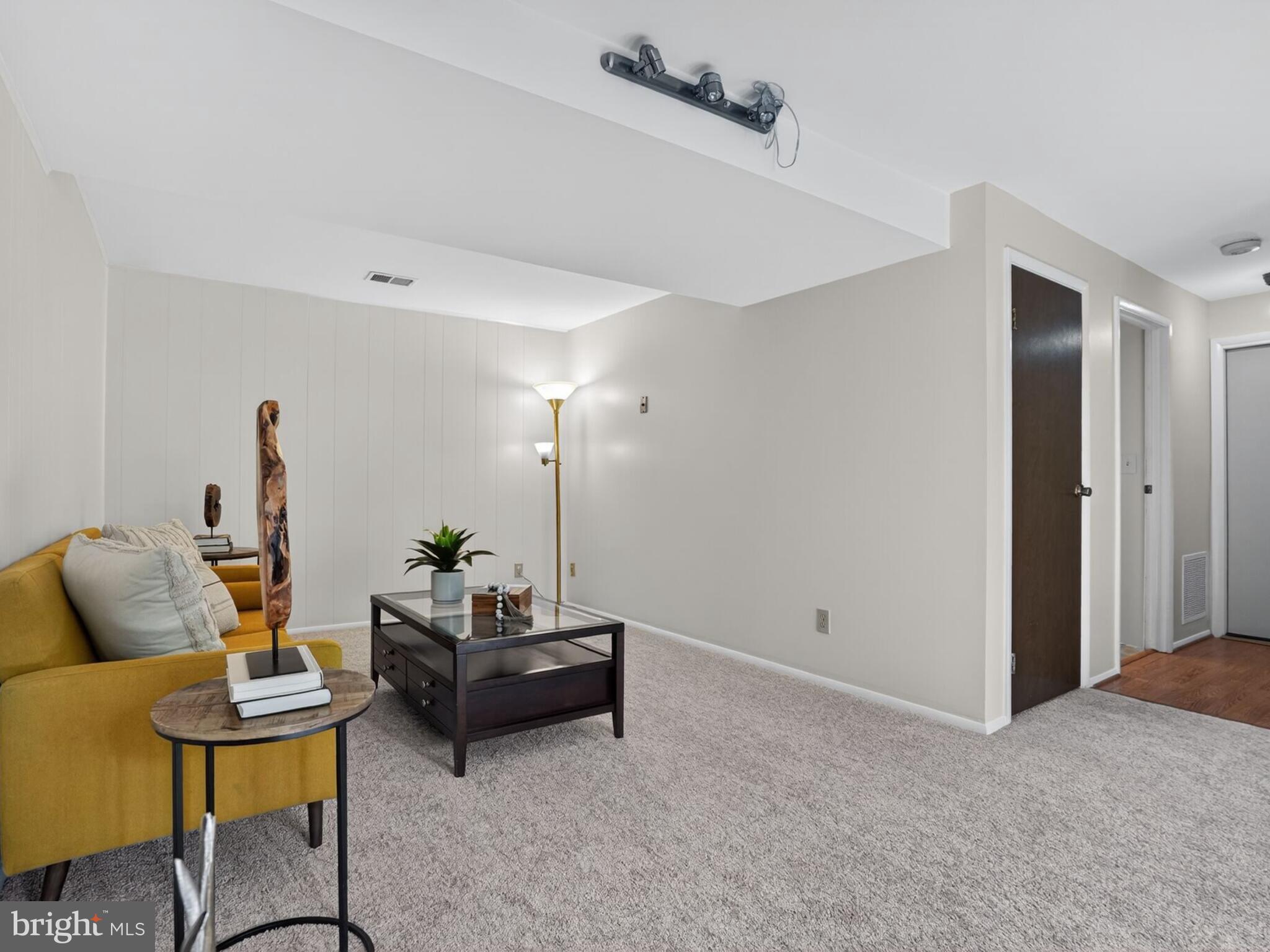 5914 Freds Oak Road Burke, VA 22015 - Photo 25 of 30 a living room with furniture and wooden floor