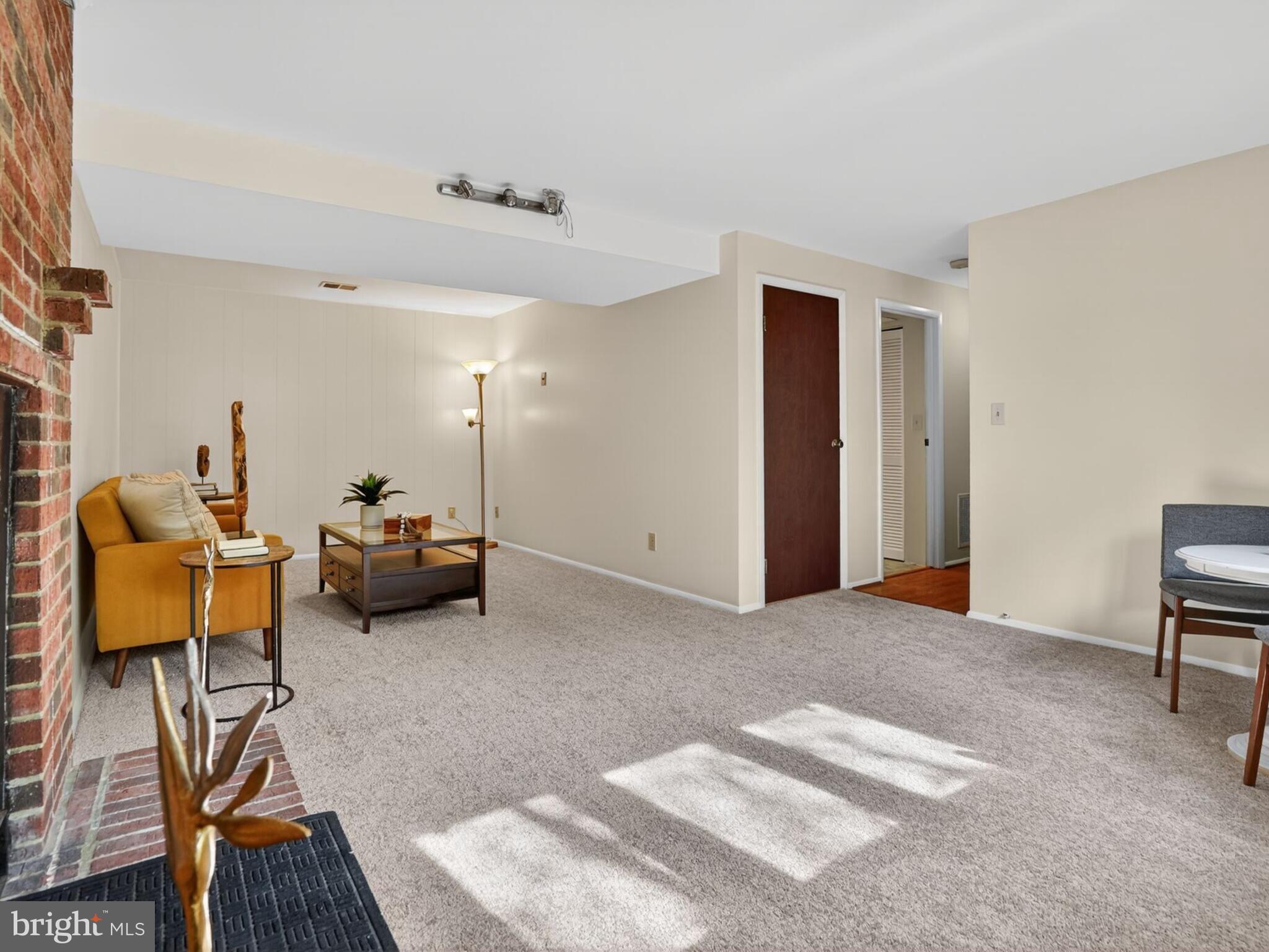5914 Freds Oak Road Burke, VA 22015 - Photo 26 of 30 a living room with furniture and a lamp