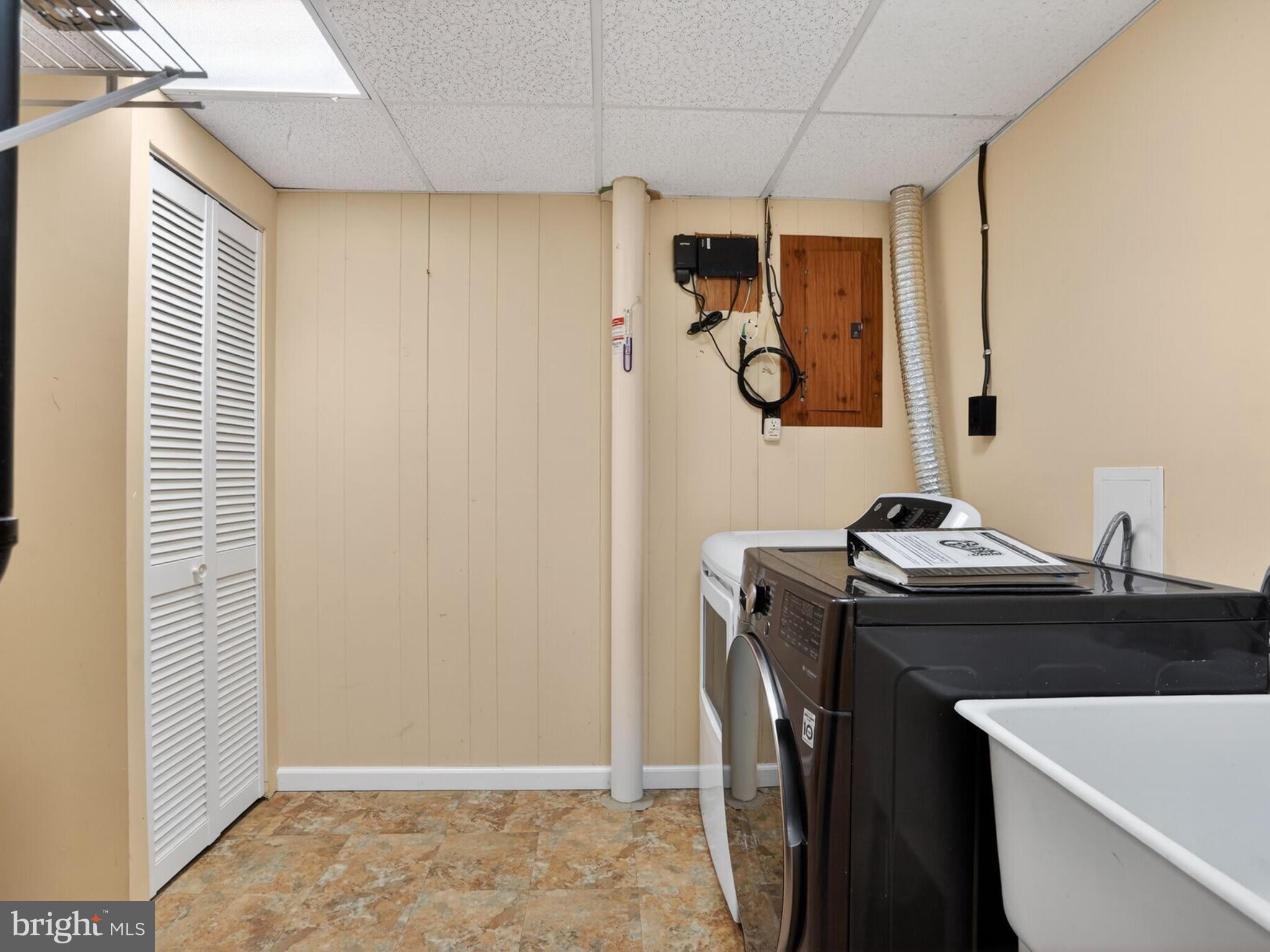5914 Freds Oak Road Burke, VA 22015 - Photo 28 of 30 a bathroom with a sink and a mirror
