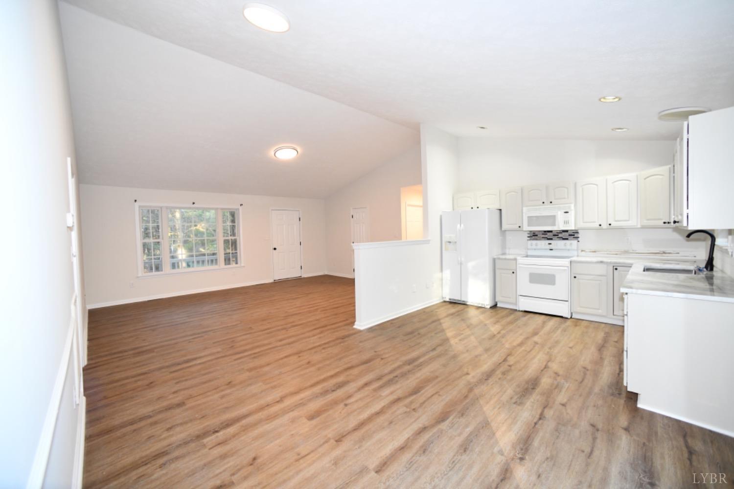 299 Sunset Ridge Drive Farmville, VA 23901 - Photo 23 of 38 a view of kitchen with wooden floor and electronic appliances