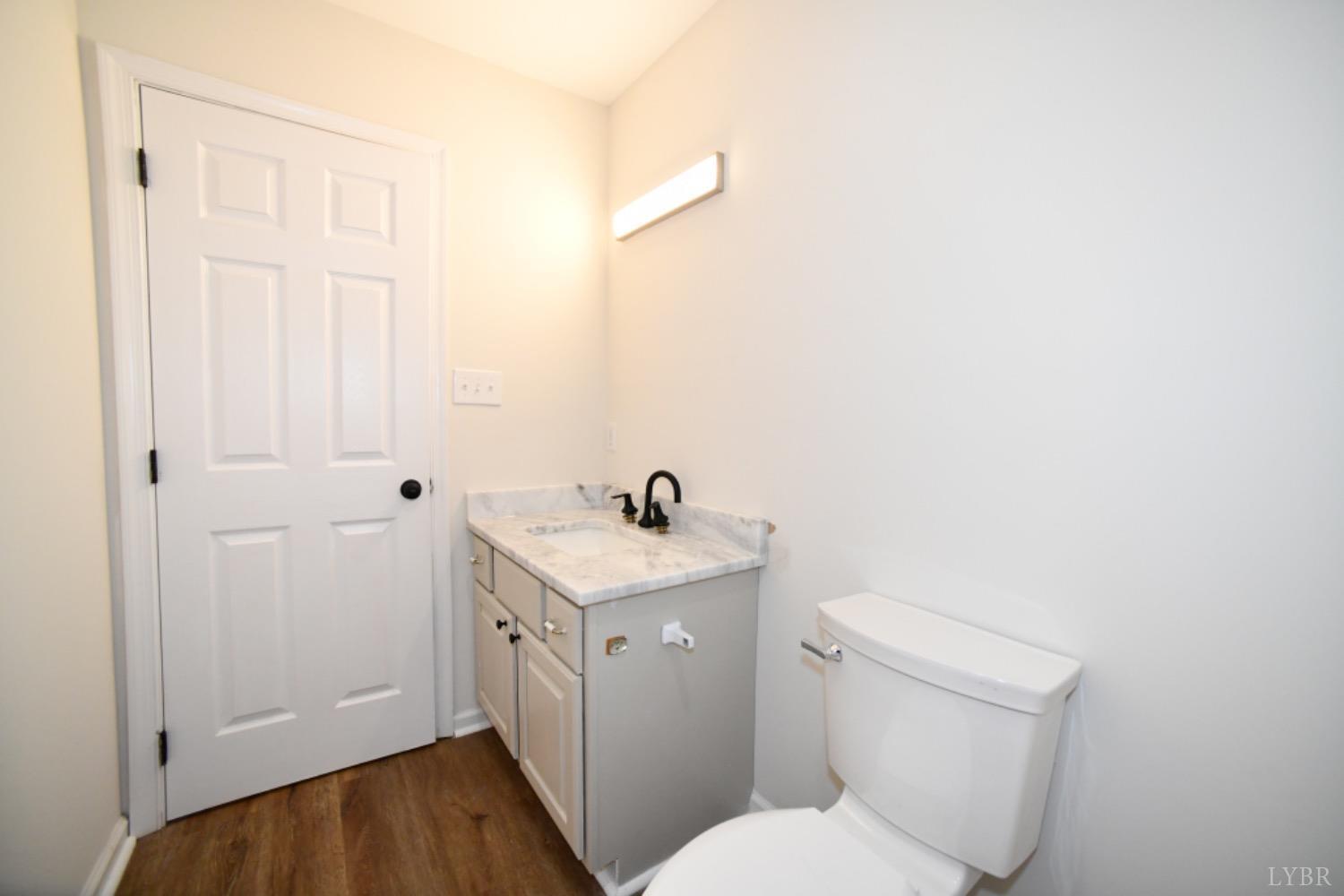 299 Sunset Ridge Drive Farmville, VA 23901 - Photo 35 of 38 a white toilet sitting next to a bathroom sink