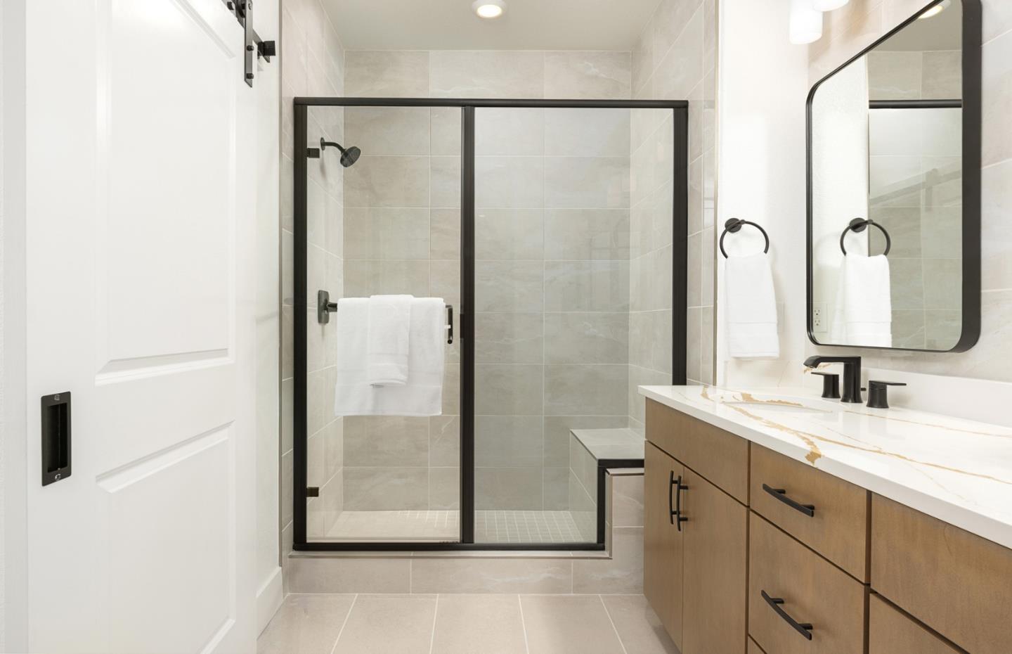 400 Tonkin Terrace, Unit 4 Sunnyvale, CA 94089 - Photo 17 of 17 a bathroom with a double vanity sink mirror and shower