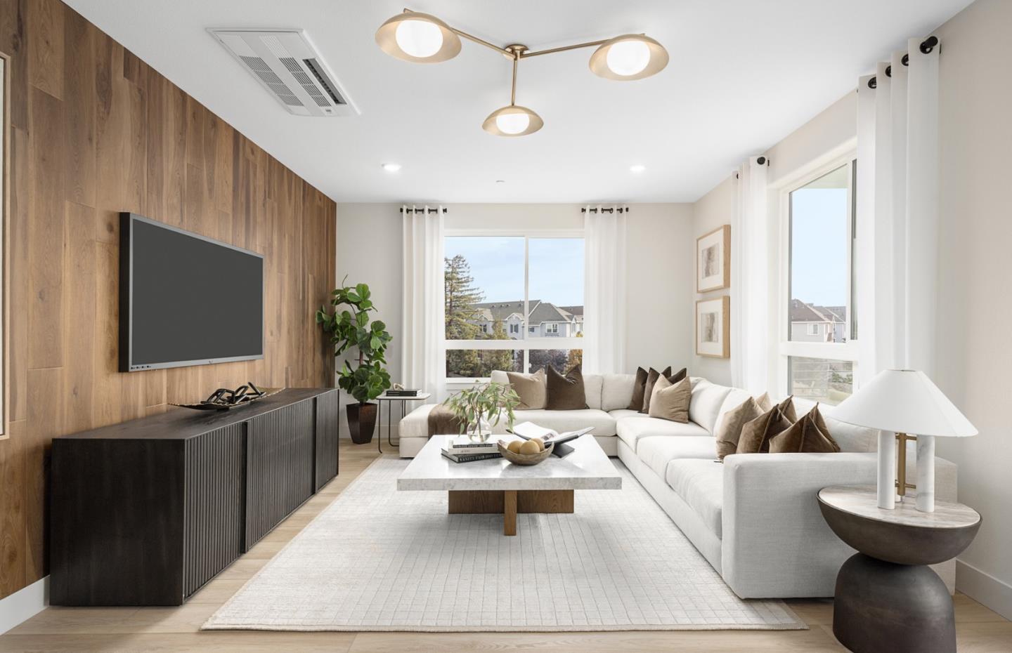 400 Tonkin Terrace, Unit 4 Sunnyvale, CA 94089 - Photo 7 of 17 a living room with furniture and a flat screen tv