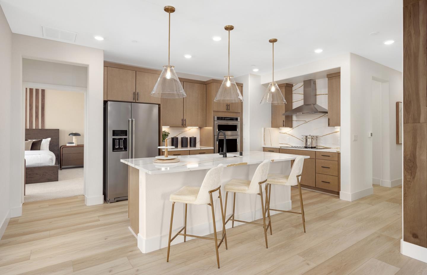 400 Tonkin Terrace, Unit 4 Sunnyvale, CA 94089 - Photo 8 of 17 a kitchen with stainless steel appliances kitchen island granite countertop a refrigerator a stove a kitchen island with a dining table and chairs