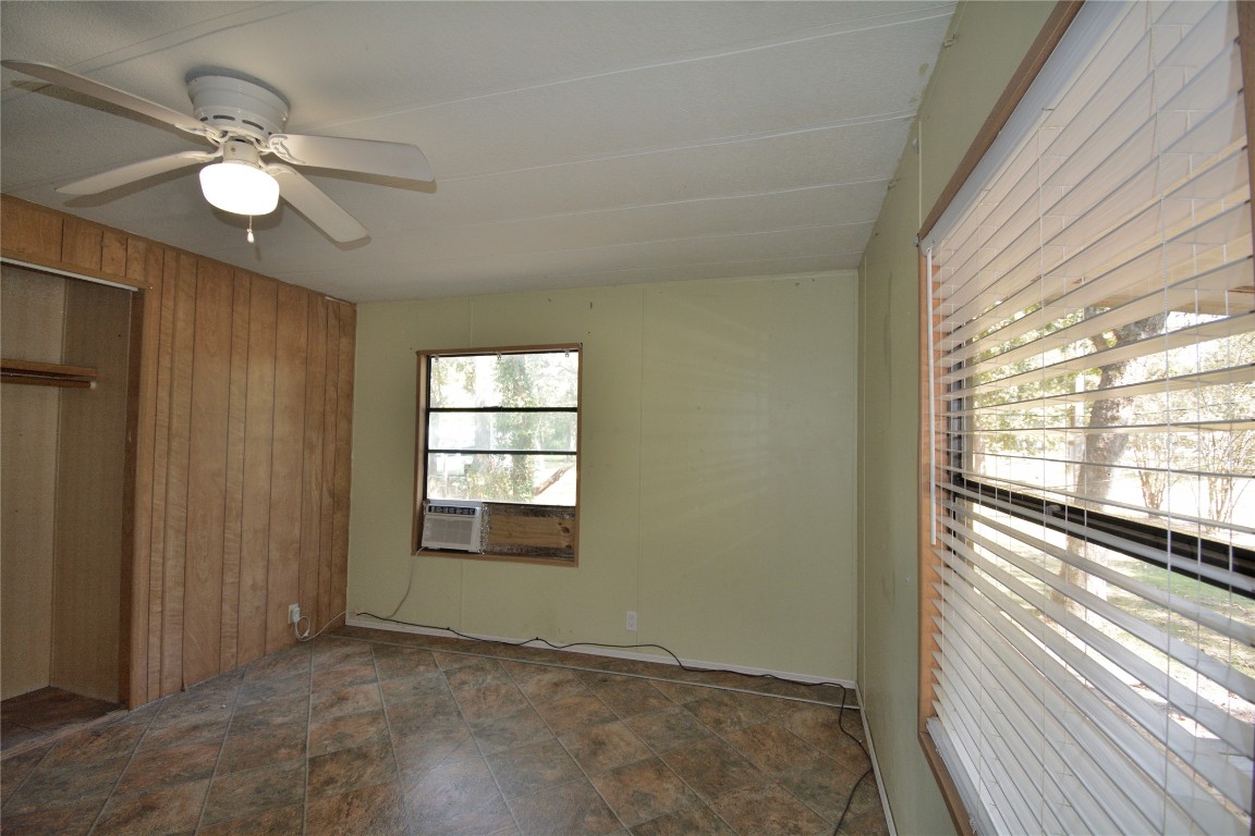 27119 Seahorse Lane Magnolia, TX 77355 - Photo 14 of 18 a view of an empty room with chandelier fan and fire place