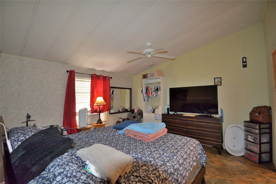 27119 Seahorse Lane Magnolia, TX 77355 - Photo 16 of 18 a living room with furniture and a flat screen tv