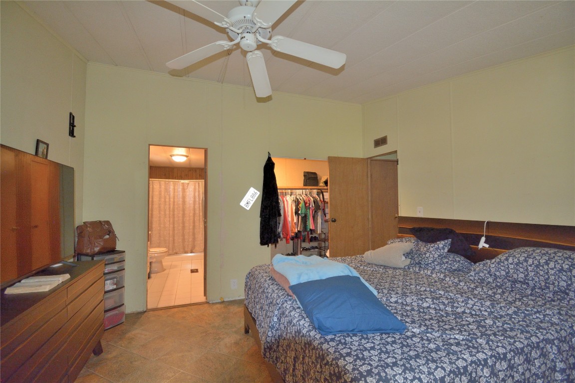 27119 Seahorse Lane Magnolia, TX 77355 - Photo 18 of 18 a bedroom with a bed dresser and a window