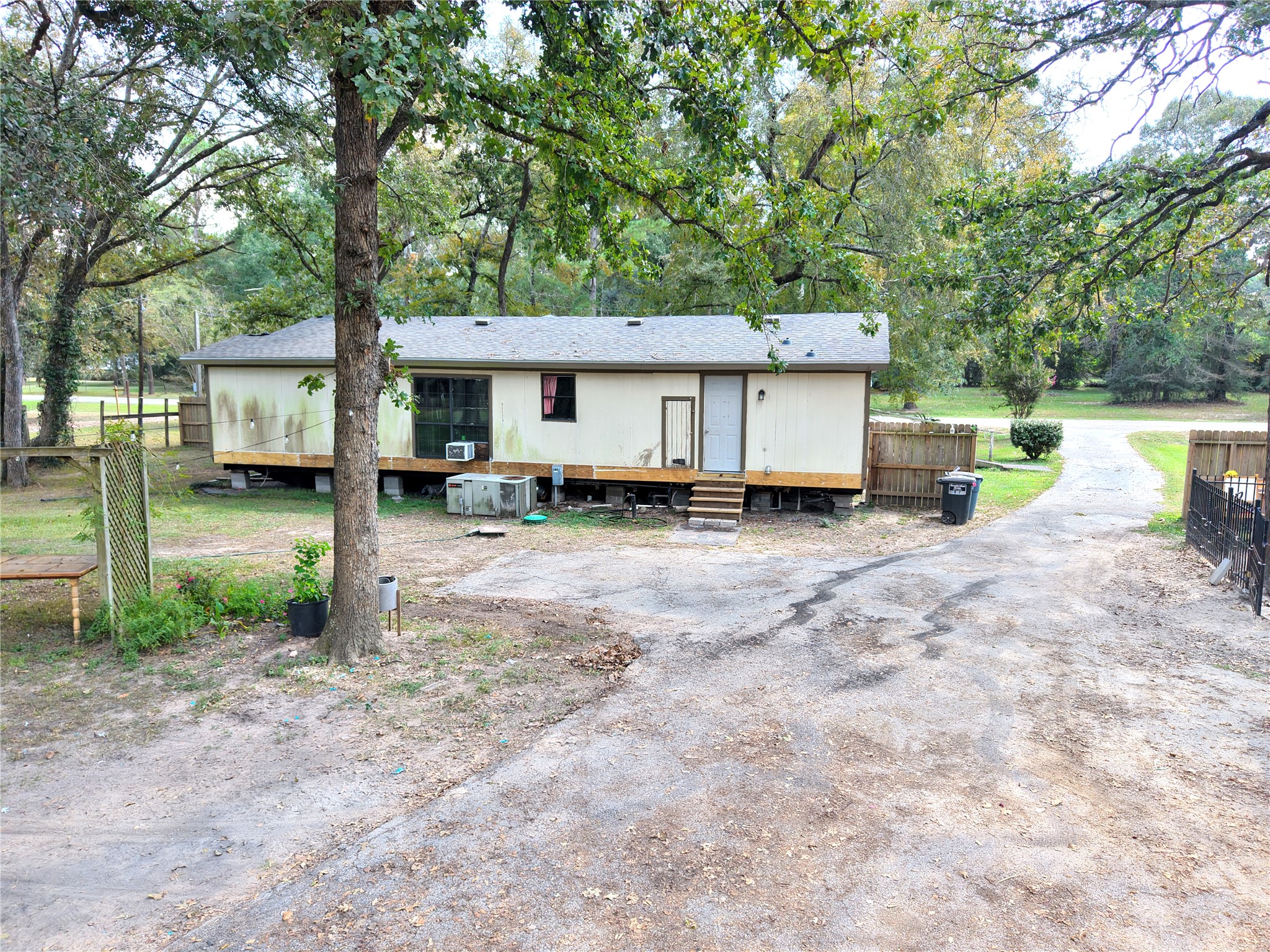 27119 Seahorse Lane Magnolia, TX 77355 - Photo 4 of 18 a view of a house with backyard and a tree