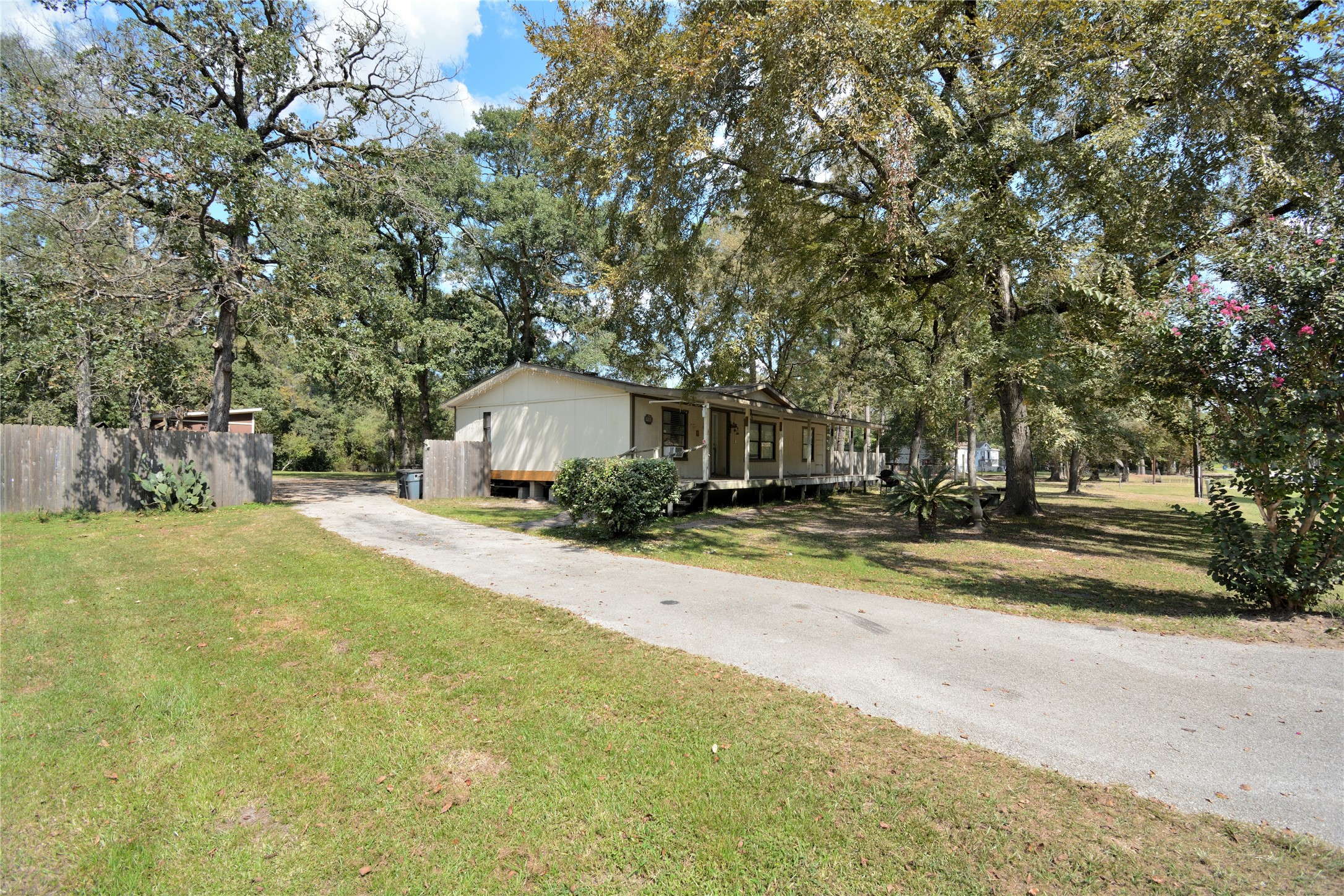 27119 Seahorse Lane Magnolia, TX 77355 - Photo 7 of 18 a front view of a house with yard and trees