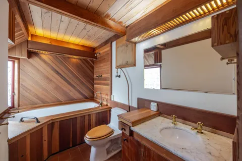 a bathroom with a sink a mirror and a shower