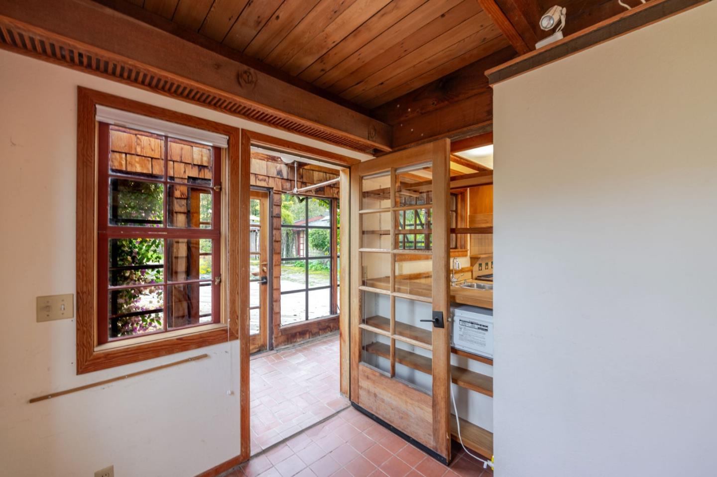 1009 Miramontes Street Half Moon Bay, CA 94019 - Photo 13 of 69 a view of a hallway with wooden floor and windows