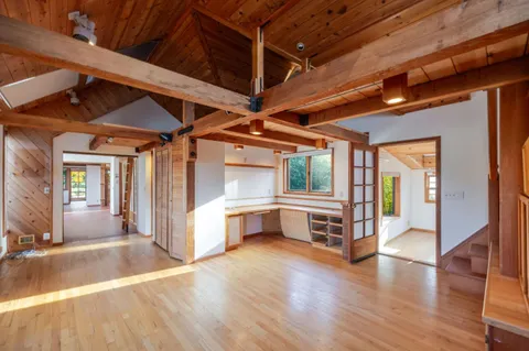a view of a patio with wooden floor