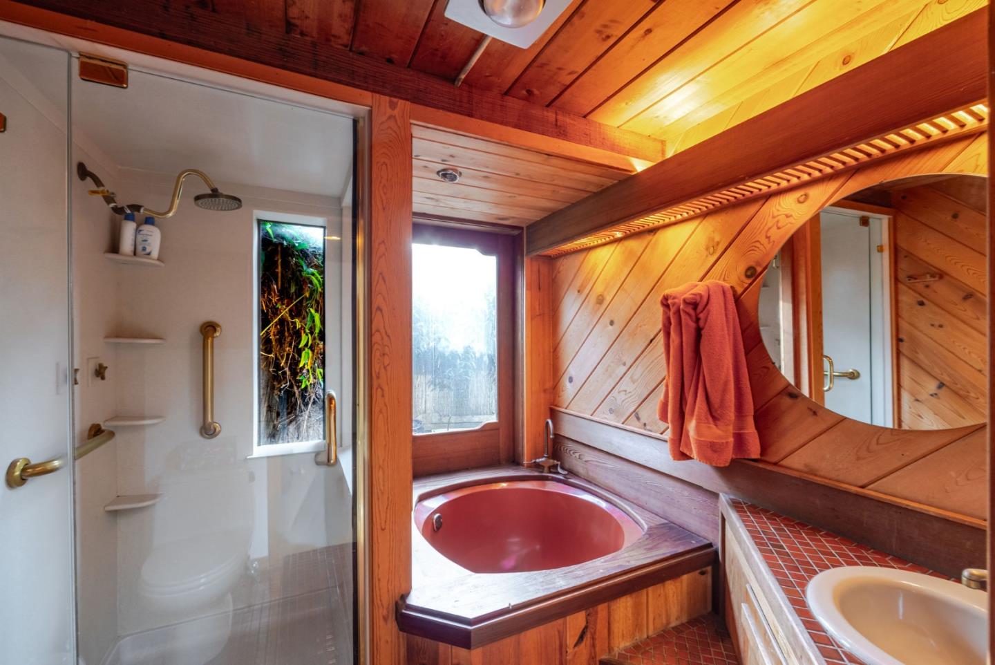 1009 Miramontes Street Half Moon Bay, CA 94019 - Photo 18 of 69 a bathroom with a sink a mirror and a shower