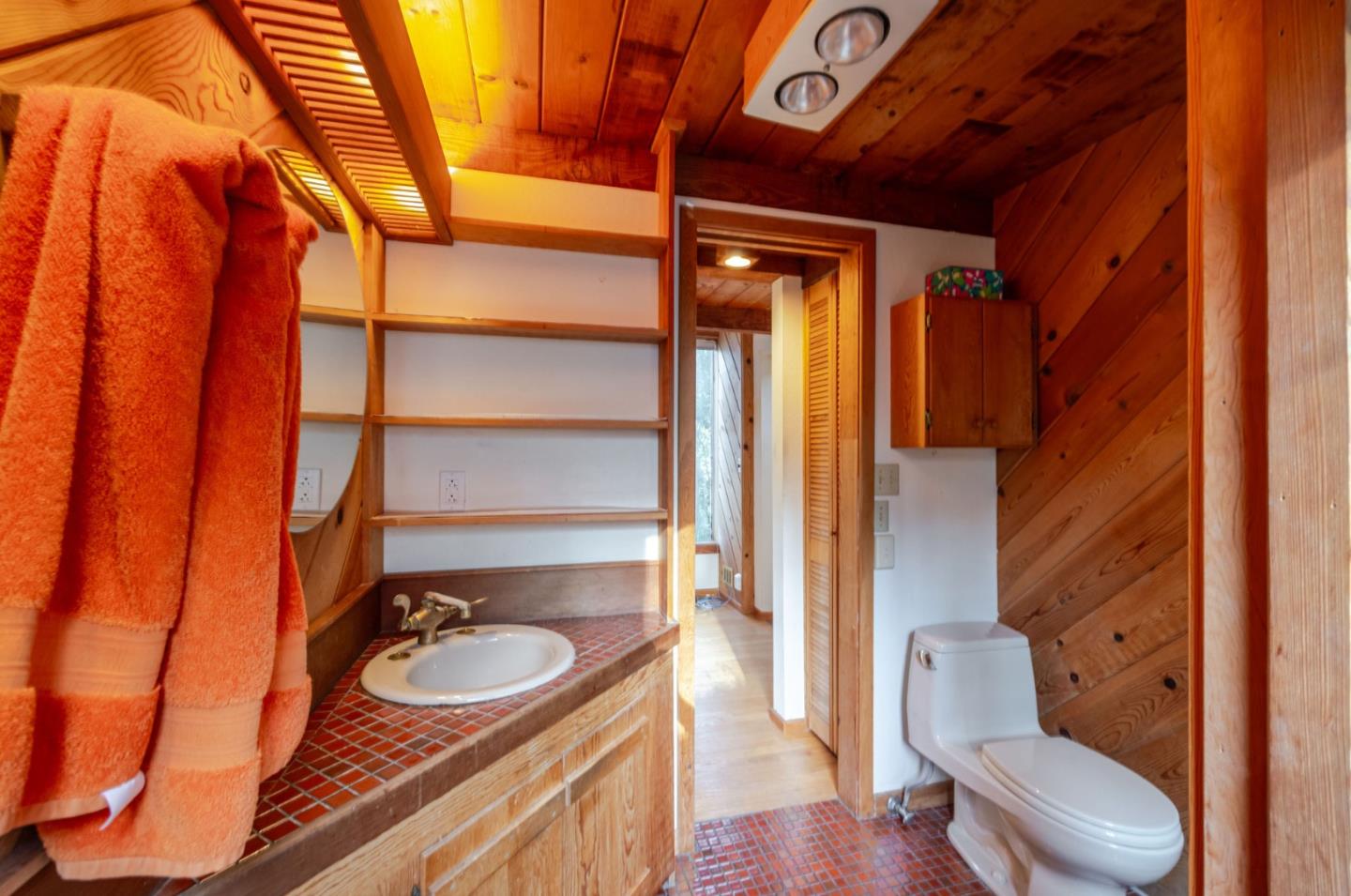 1009 Miramontes Street Half Moon Bay, CA 94019 - Photo 19 of 69 a bathroom with a sink and a mirror