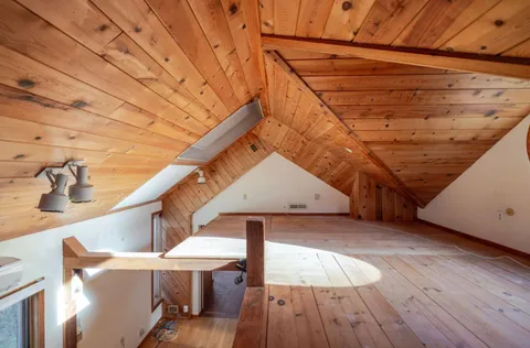 a view of a room that has a large window