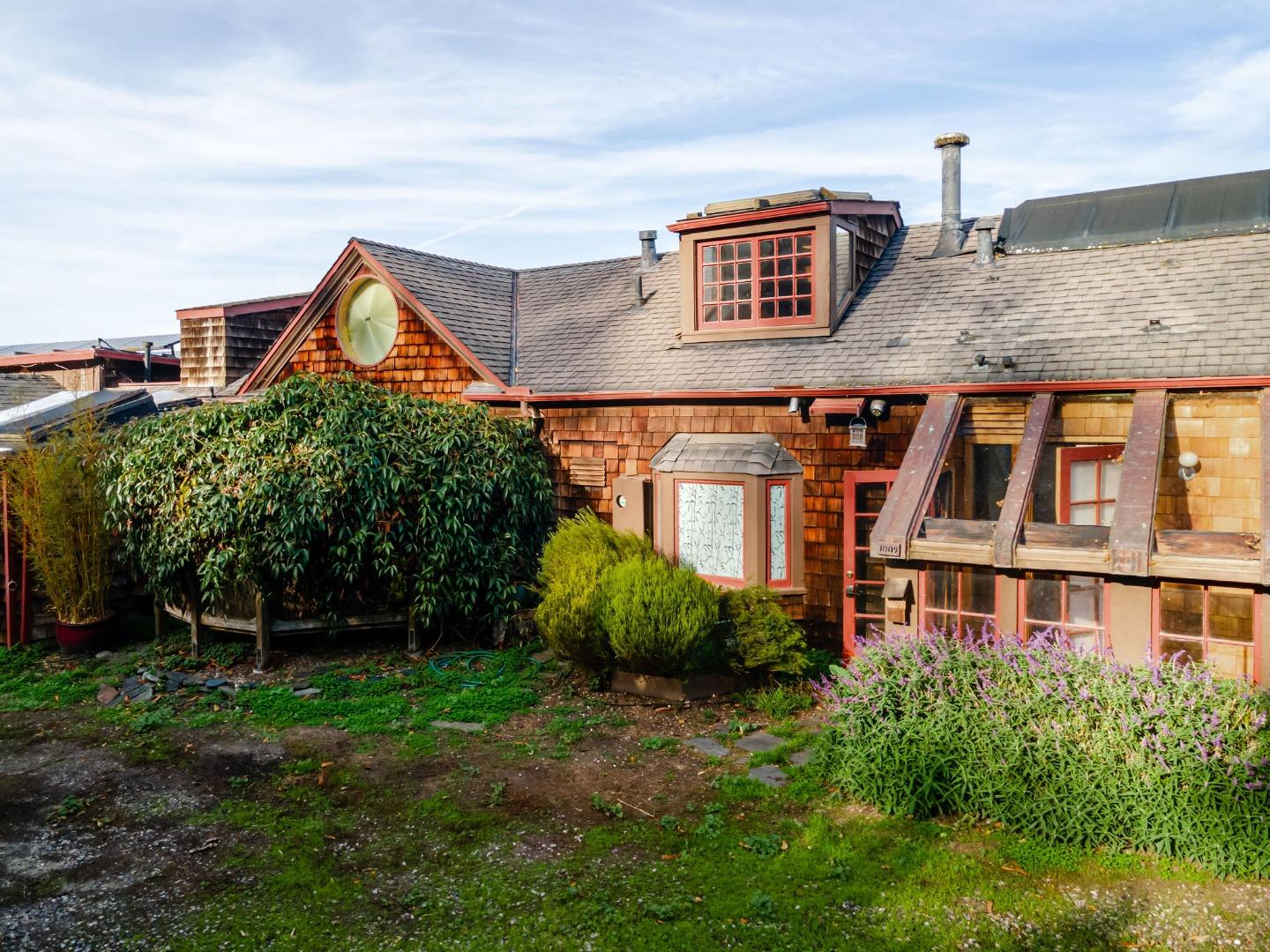 1009 Miramontes Street Half Moon Bay, CA 94019 - Photo 25 of 69 a front view of a house with garden