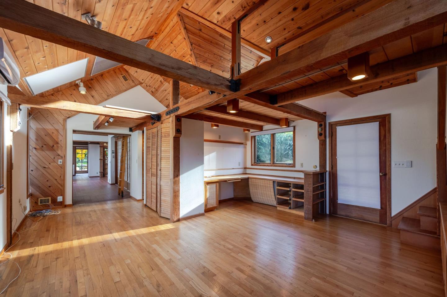 1009 Miramontes Street Half Moon Bay, CA 94019 - Photo 29 of 69 a view of a room with wooden floor and furniture
