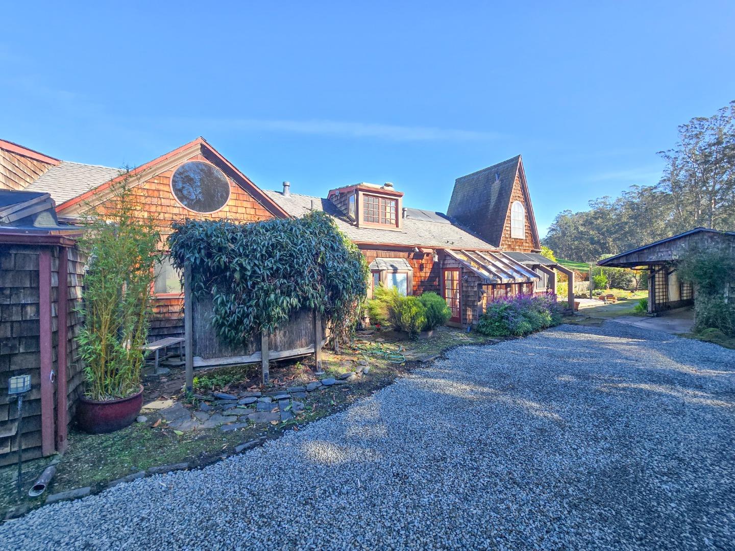 1009 Miramontes Street Half Moon Bay, CA 94019 - Photo 4 of 69 a front view of a house with a yard