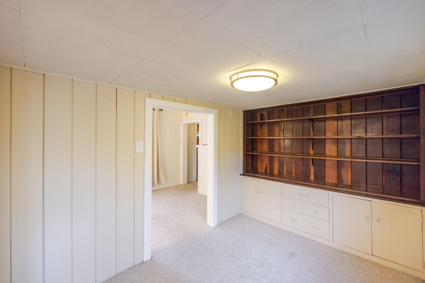1009 Miramontes Street Half Moon Bay, CA 94019 - Photo 48 of 69 a view of an empty room with cabinet and gate