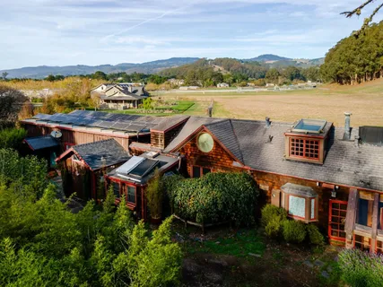 a kitchen with a stove and a refrigerator