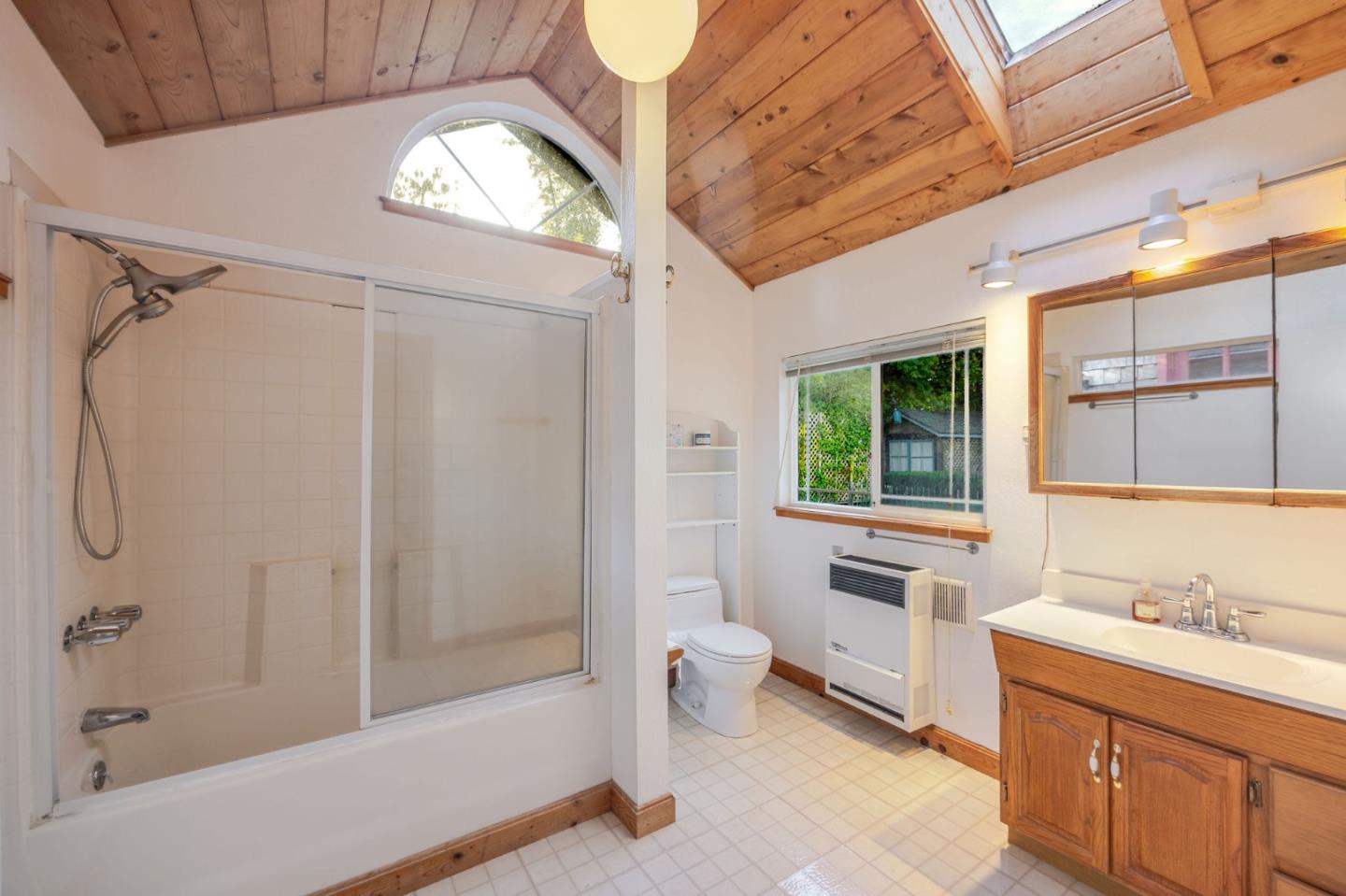 1009 Miramontes Street Half Moon Bay, CA 94019 - Photo 51 of 69 a bathroom with a sink a toilet and shower