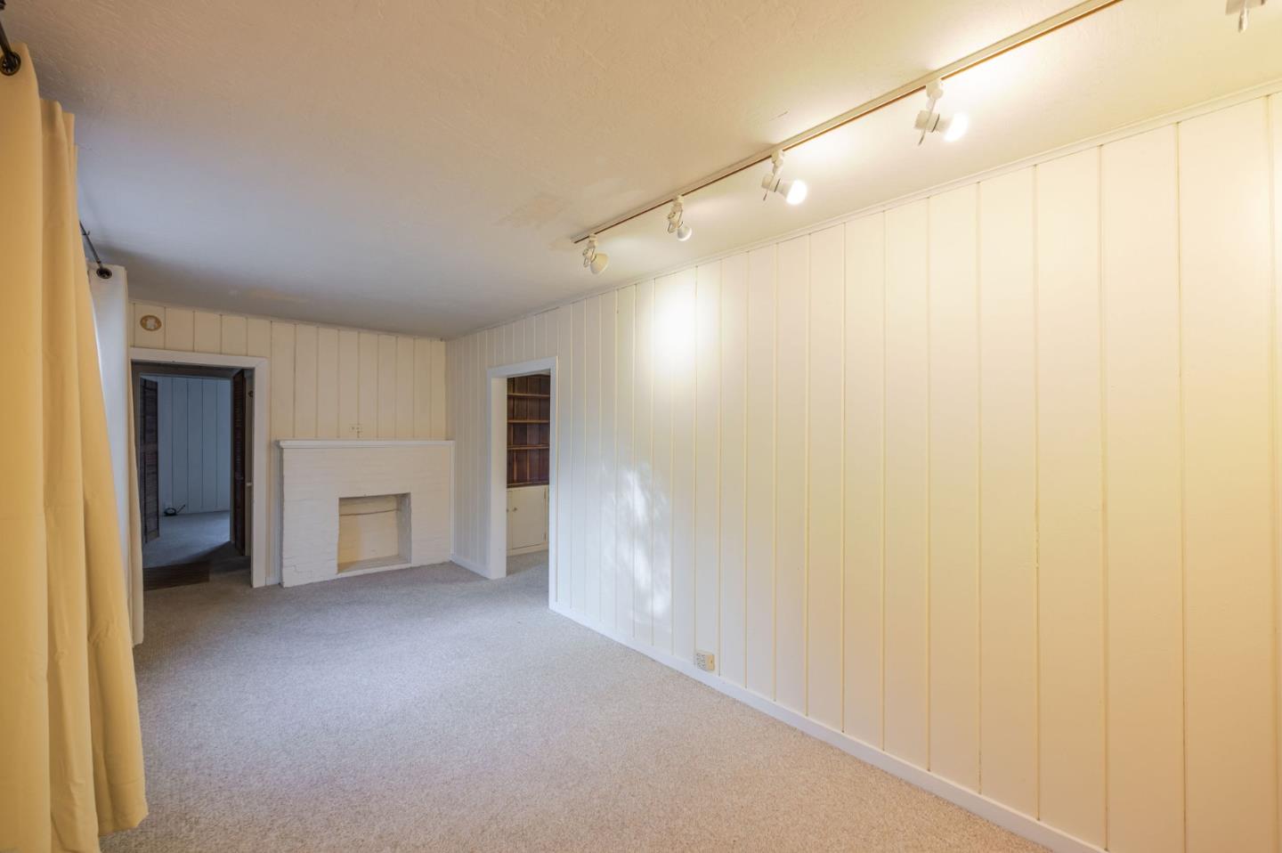 1009 Miramontes Street Half Moon Bay, CA 94019 - Photo 59 of 69 a view of empty room with a fireplace