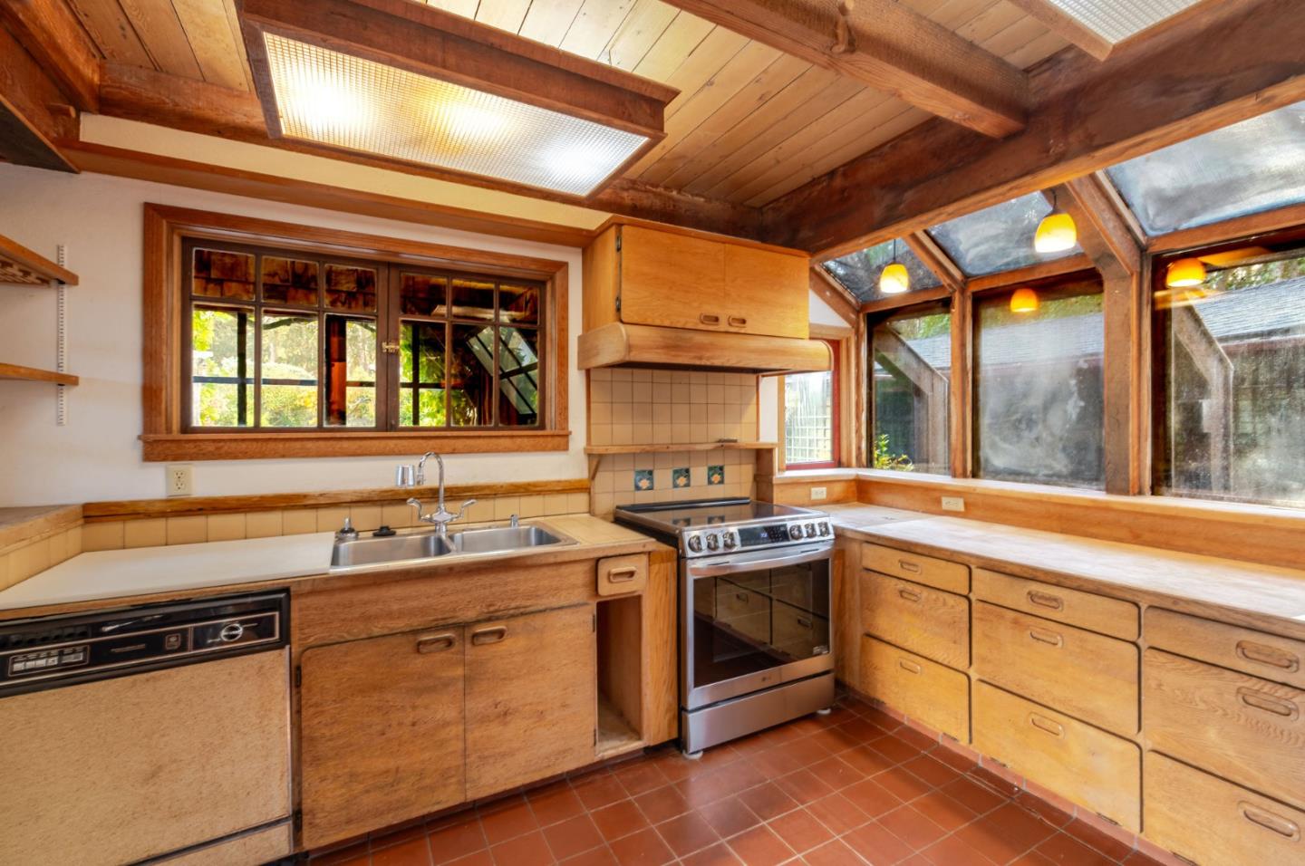 1009 Miramontes Street Half Moon Bay, CA 94019 - Photo 6 of 69 a kitchen that has a sink and a stove